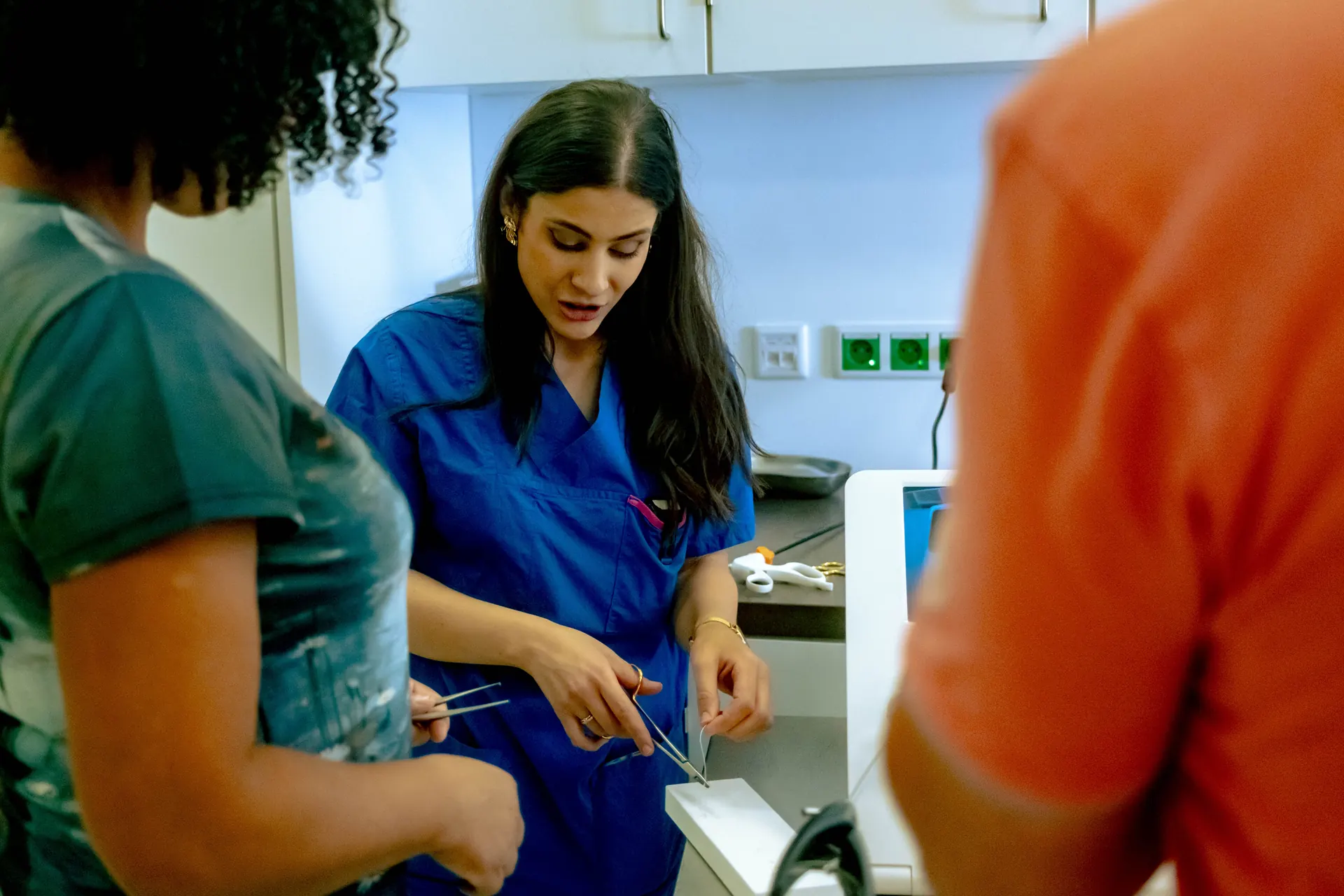 Doctor showing how the suturing is done on the open day
